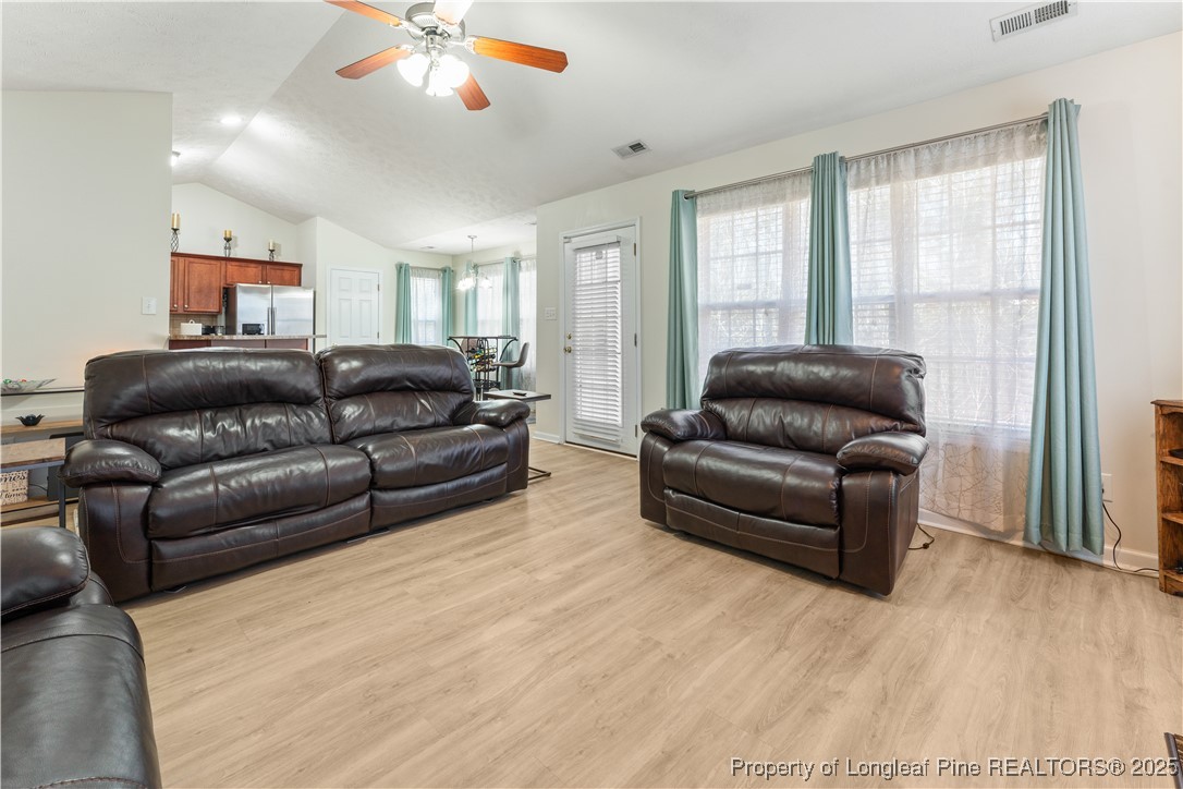 292 Falling Leaf Drive Raeford, NC 28376 - Photo 12 of 40 a living room with furniture and a window