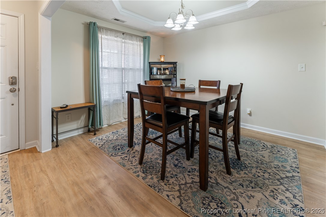 292 Falling Leaf Drive Raeford, NC 28376 - Photo 15 of 40 a view of a dining room with furniture