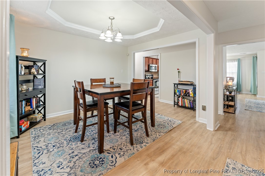 292 Falling Leaf Drive Raeford, NC 28376 - Photo 16 of 40 a view of a dining room with furniture