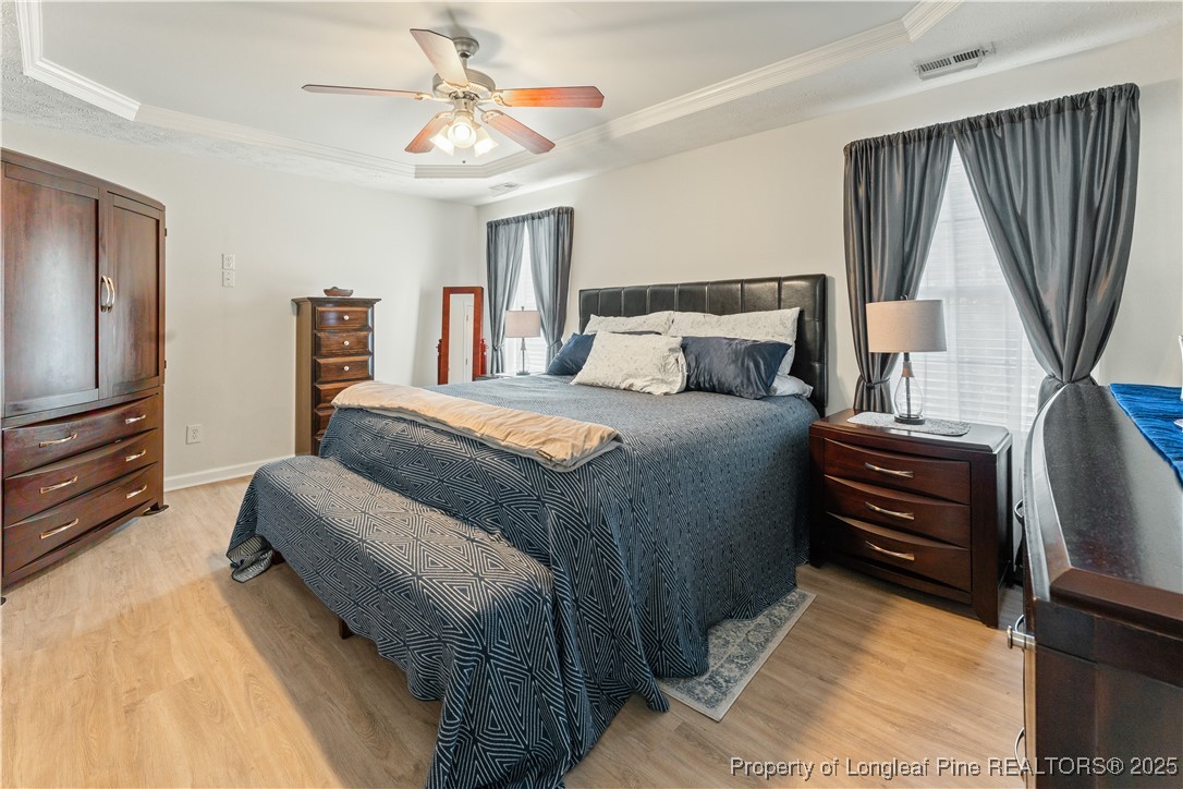 292 Falling Leaf Drive Raeford, NC 28376 - Photo 19 of 40 a bedroom with a bed and a television