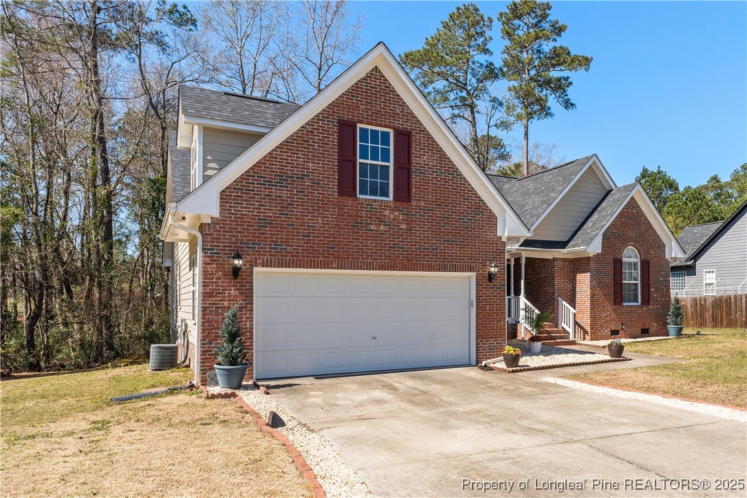 292 Falling Leaf Drive Raeford, NC 28376 - Photo 2 of 40 a front view of a house with a yard