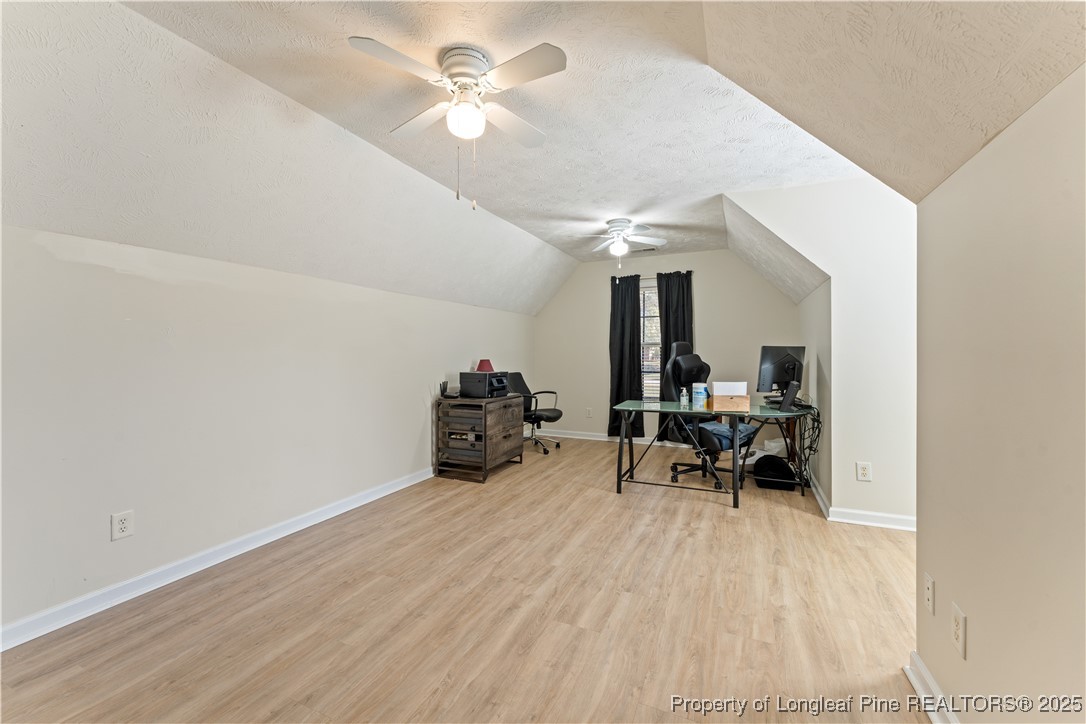 292 Falling Leaf Drive Raeford, NC 28376 - Photo 26 of 40 a view of a room with furniture and a chandelier fan