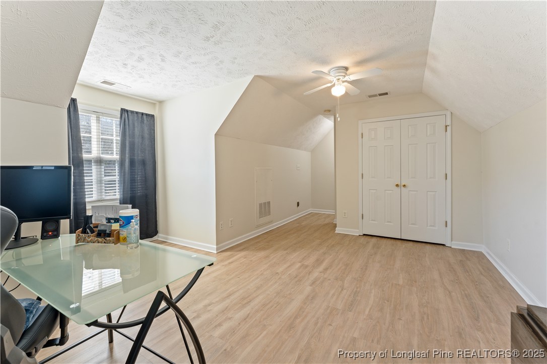 292 Falling Leaf Drive Raeford, NC 28376 - Photo 28 of 40 a view of a livingroom with furniture and chandelier fan