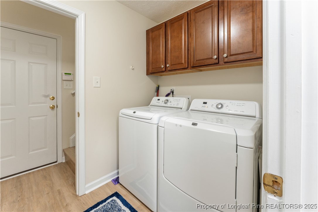 292 Falling Leaf Drive Raeford, NC 28376 - Photo 29 of 40 a utility room with dryer and washer