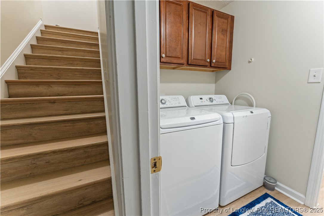292 Falling Leaf Drive Raeford, NC 28376 - Photo 30 of 40 a utility room with dryer and washer