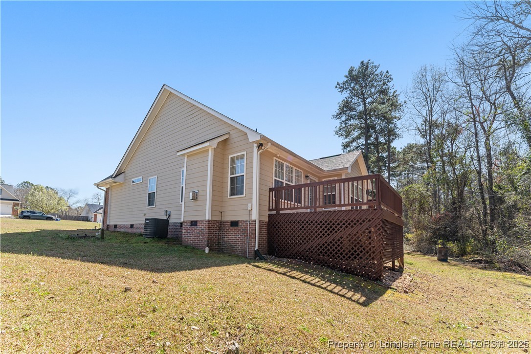 292 Falling Leaf Drive Raeford, NC 28376 - Photo 34 of 40 a view of a house with a yard covered in snow