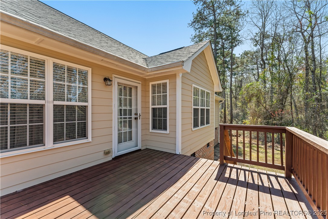 292 Falling Leaf Drive Raeford, NC 28376 - Photo 36 of 40 a view of a house with a deck