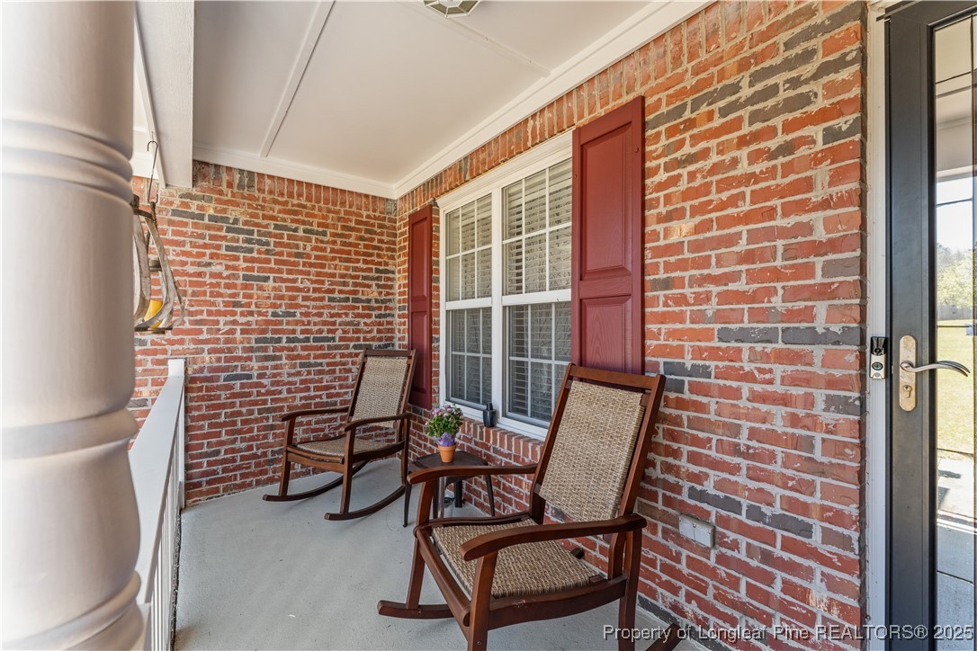 292 Falling Leaf Drive Raeford, NC 28376 - Photo 4 of 40 a view of a room with chairs and a potted plant