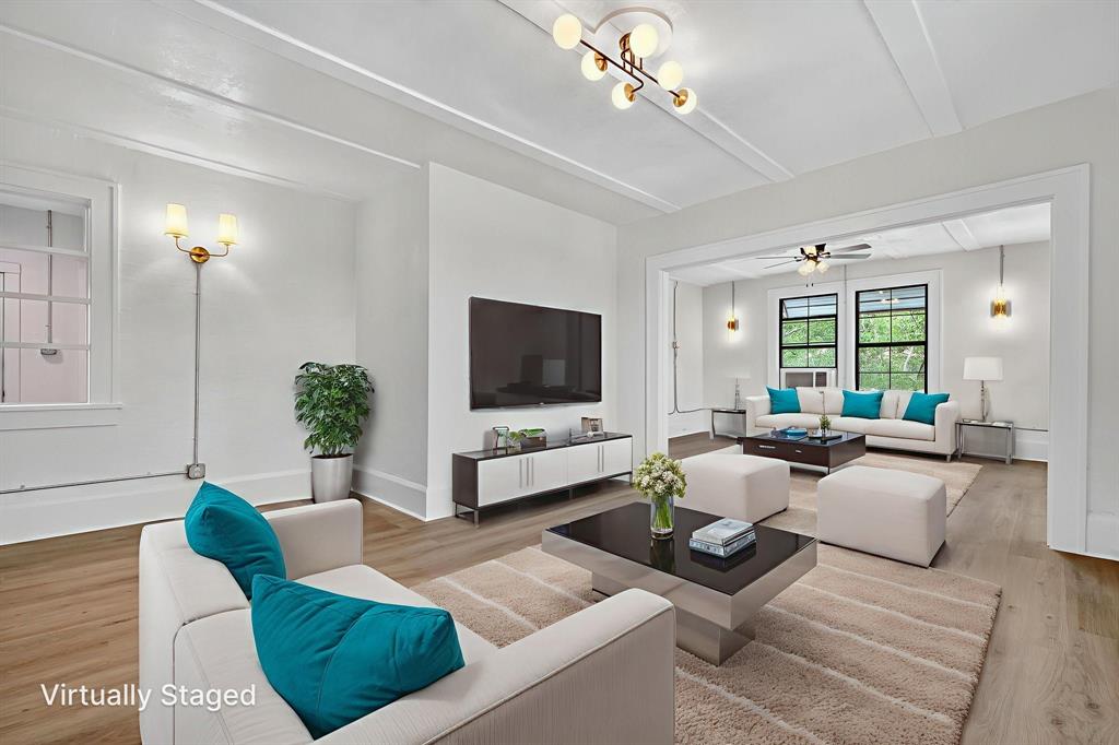 513 Northwest 6th Street, Unit 4 Mineral Wells, TX 76067 - Photo 12 of 34 a living room with furniture and a flat screen tv