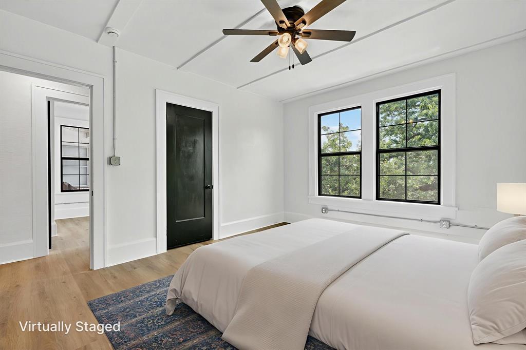 513 Northwest 6th Street, Unit 4 Mineral Wells, TX 76067 - Photo 21 of 34 a bedroom with a large bed and a window