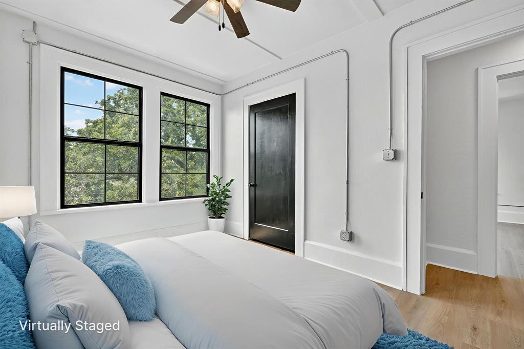 513 Northwest 6th Street, Unit 4 Mineral Wells, TX 76067 - Photo 27 of 34 a bedroom with a bed and a large window
