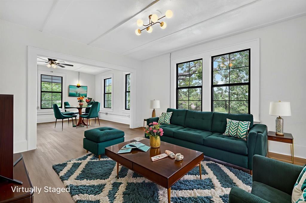 513 Northwest 6th Street, Unit 4 Mineral Wells, TX 76067 - Photo 8 of 34 a living room with furniture and wooden floor