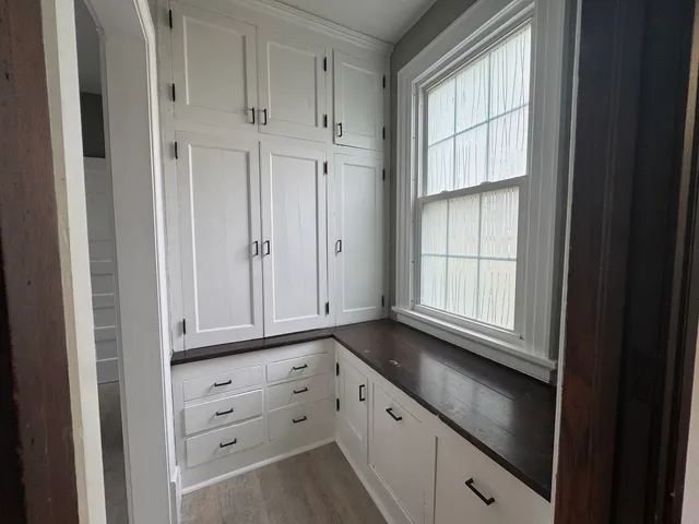 a kitchen with a refrigerator and sink