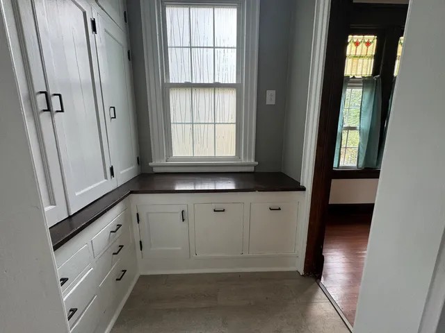 a white toilet sitting next to a bathroom sink