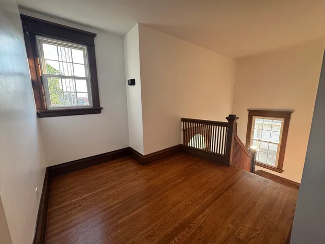 a bathroom with a tub and a window