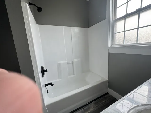 a view of room window and wooden floor