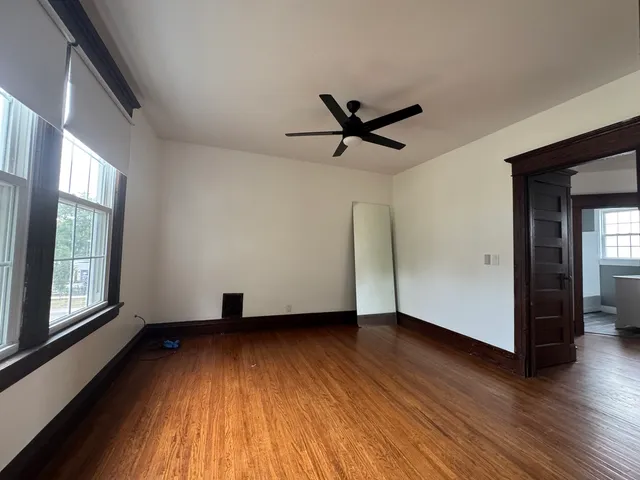 a view of staircase with wooden floor