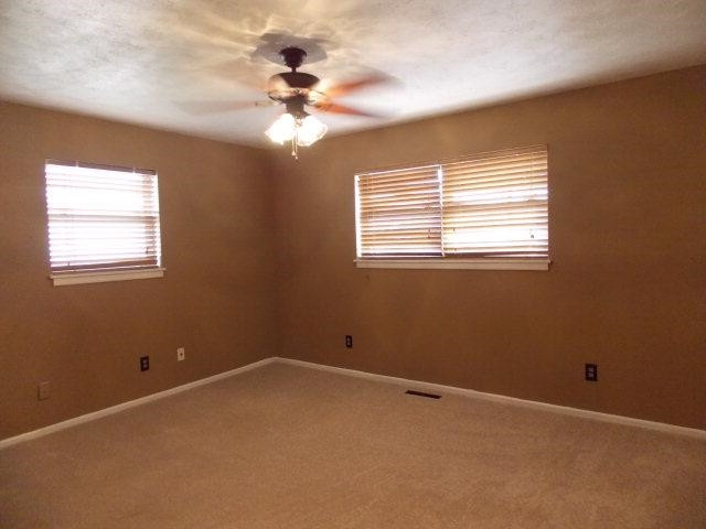 4702 31st Street Lubbock, TX 79410 - Photo 5 of 10 a view of an empty room with a window