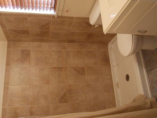 4702 31st Street Lubbock, TX 79410 - Photo 6 of 10 a bathroom with a shower