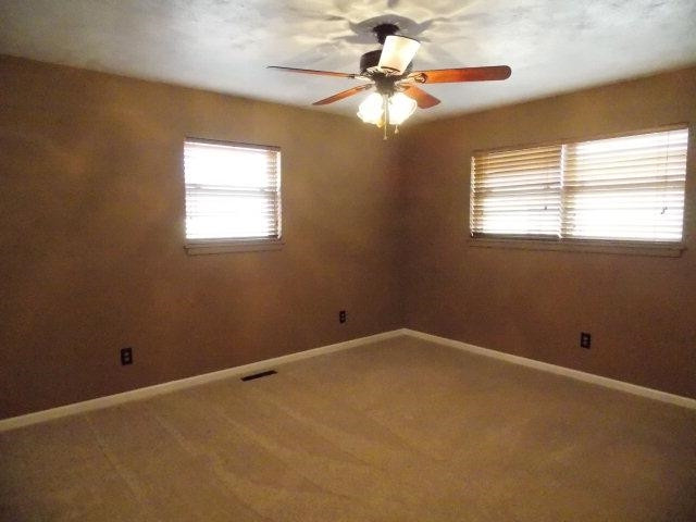 4702 31st Street Lubbock, TX 79410 - Photo 8 of 10 an empty room with a window