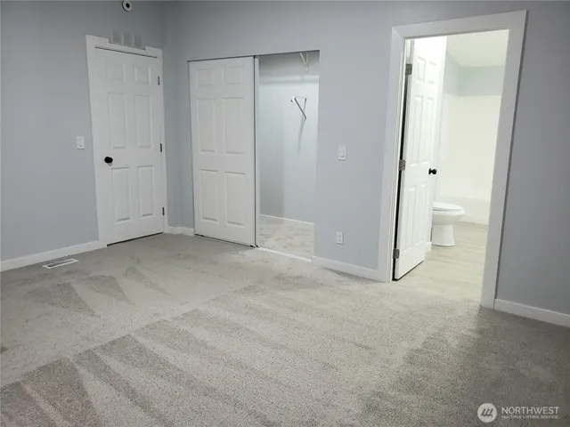 a bathroom with a toilet and a bathtub