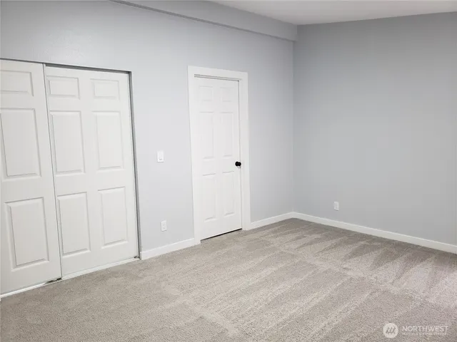 a view of a house with a yard and garage