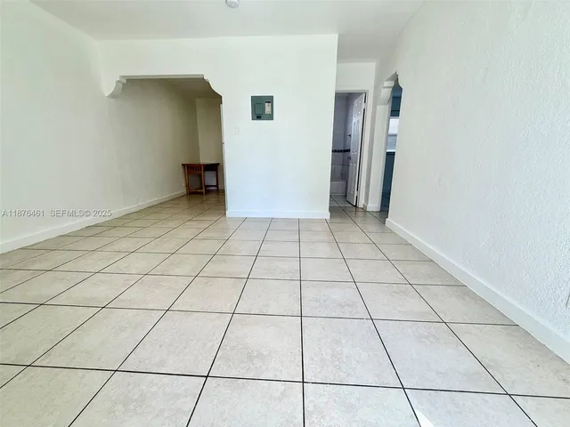 a view of a livingroom and an empty room