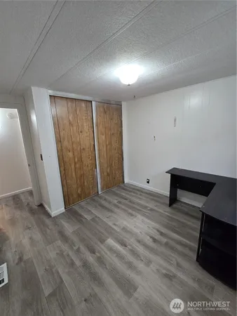 a view of a livingroom with wooden floor