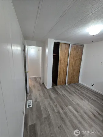a view of a livingroom with wooden floor