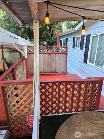 a view of a wooden house with a large window