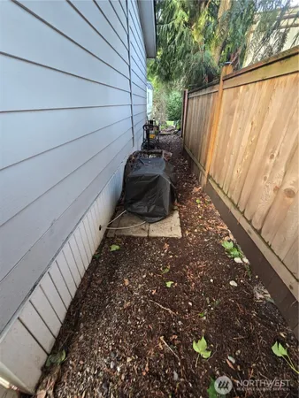 a view of a backyard with pathway