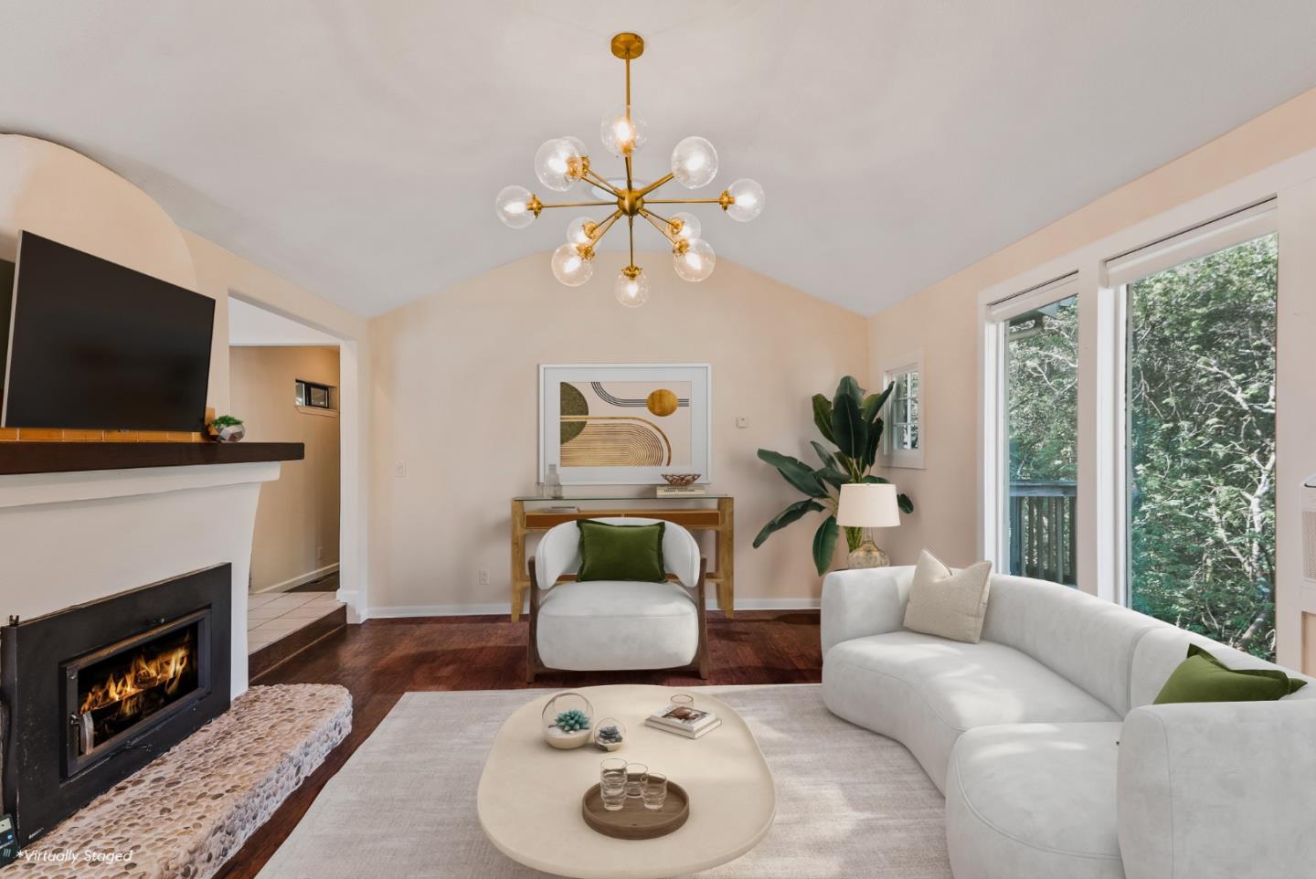 a living room with furniture and a fireplace