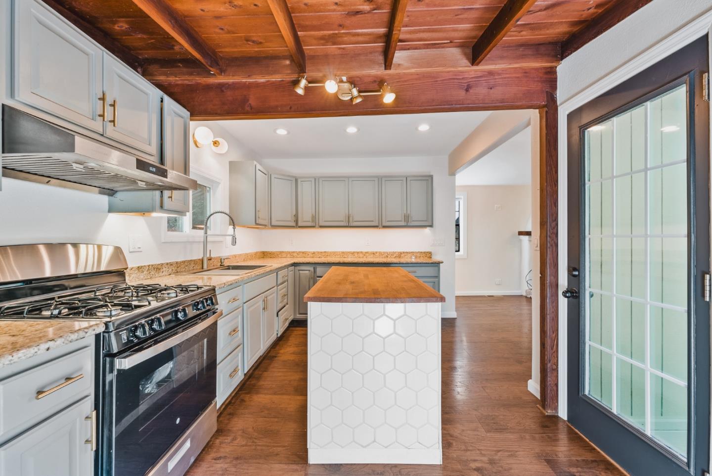 482 Riverview Drive Boulder Creek, CA 95006 - Photo 4 of 27 a kitchen with stainless steel appliances granite countertop a stove a sink and a refrigerator
