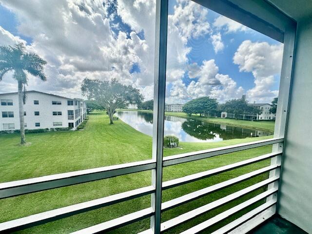 583 Fanshaw North, Unit N Boca Raton, FL 33434 - Photo 11 of 36 Screened Patio w/Lake View