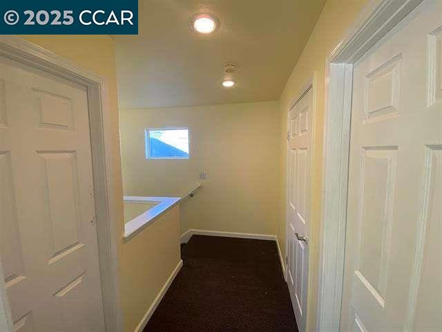 150 Rodeo Avenue Rodeo, CA 94572 - Photo 15 of 20 a view of a hallway with wooden floor