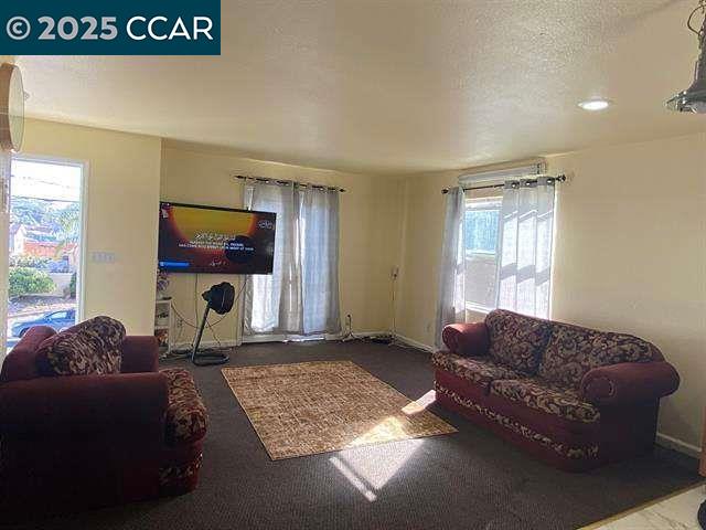 150 Rodeo Avenue Rodeo, CA 94572 - Photo 4 of 20 a living room with furniture and a window