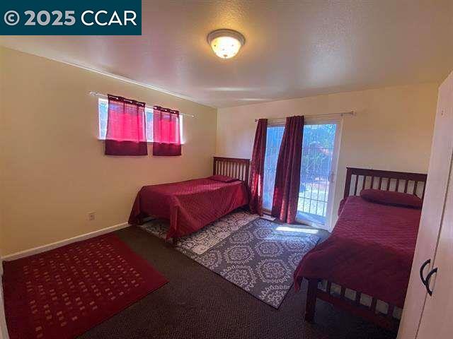 150 Rodeo Avenue Rodeo, CA 94572 - Photo 8 of 20 a bedroom with a bed and wooden floor