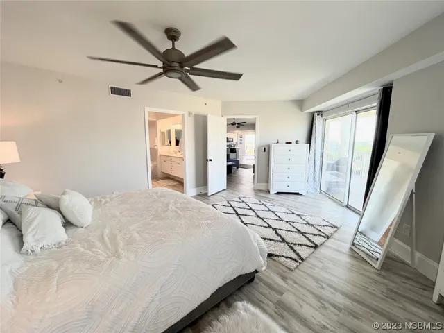 a bathroom with a double vanity sink mirror and shower