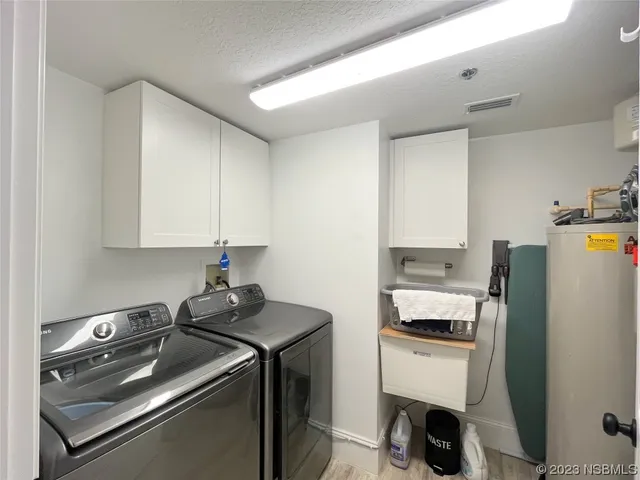 a view of a backyard with large trees