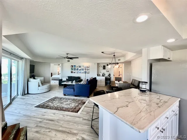 a hallway with a sink and a mirror