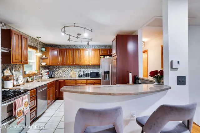 a kitchen with a sink cabinets and window