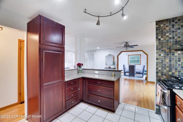 a kitchen with a sink stove and refrigerator