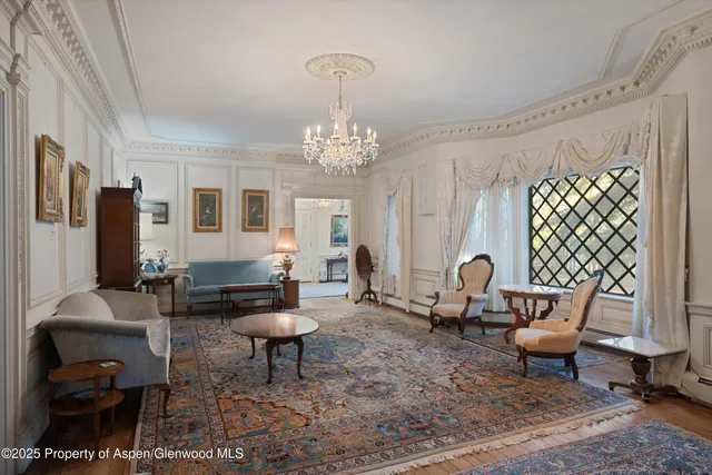 a view of backyard with swimming pool and outdoor seating