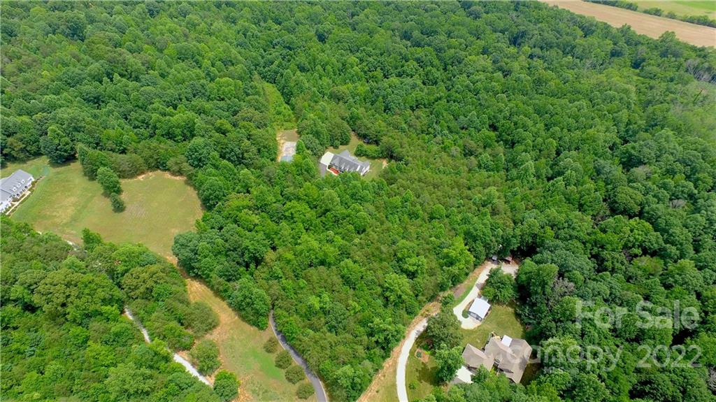 765 Bridle Path Farm Road Cleveland, NC 27013 - Photo 12 of 46 a bird view of a house with a yard and lake view
