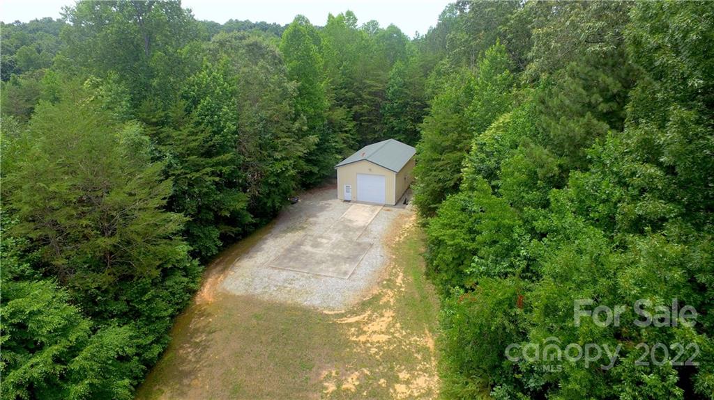 765 Bridle Path Farm Road Cleveland, NC 27013 - Photo 10 of 46 a view of a pathway with a garden