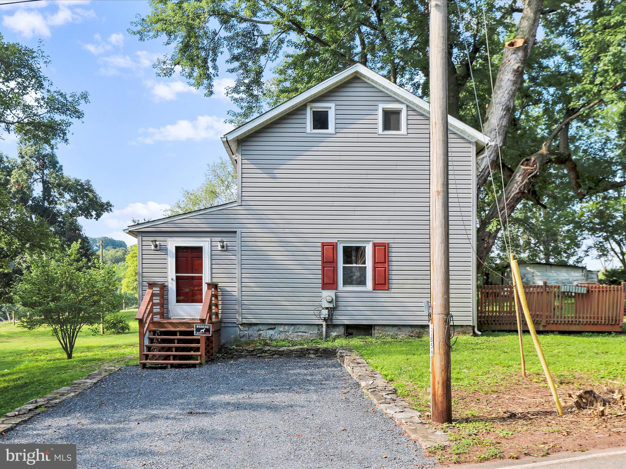 a view of a house with a backyard