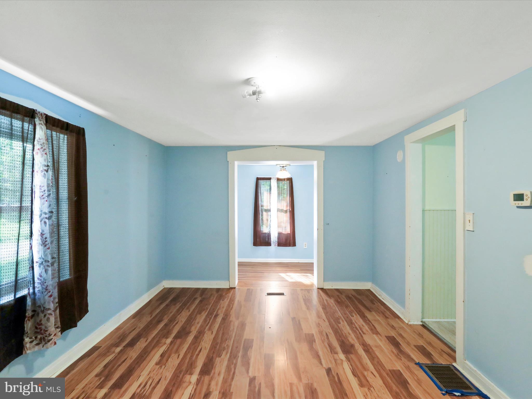 11856 Nicholson Road Keymar, MD 21757 - Photo 11 of 31 a view of a room with wooden floor and window