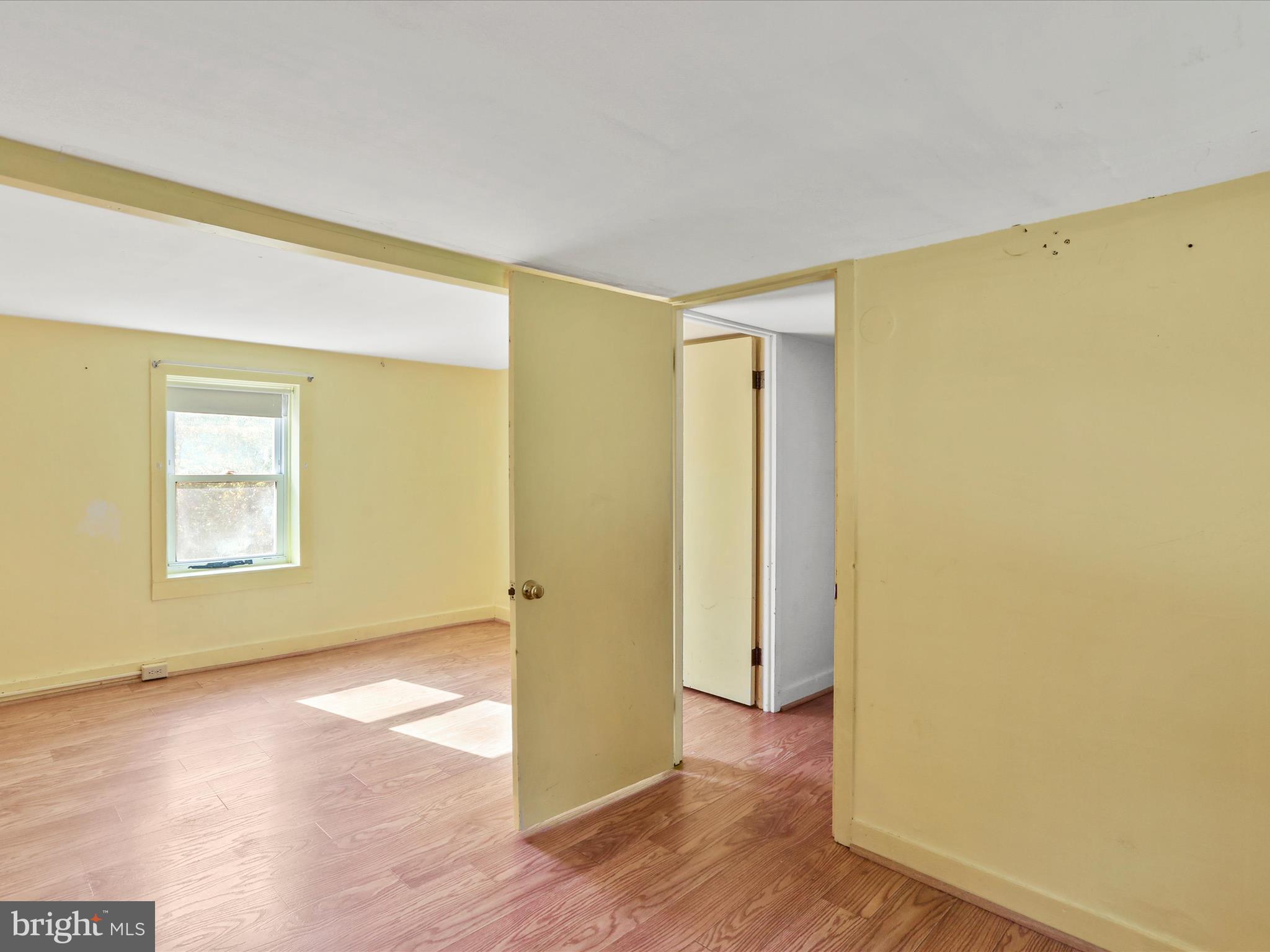 11856 Nicholson Road Keymar, MD 21757 - Photo 18 of 31 a view of a room with wooden floor and a window