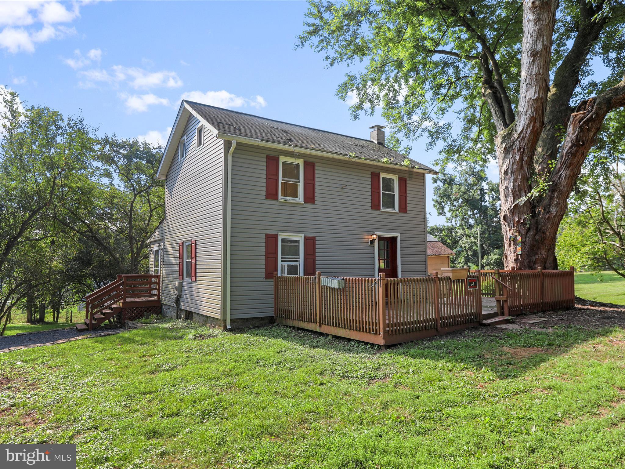 11856 Nicholson Road Keymar, MD 21757 - Photo 26 of 31 a view of backyard with a garden and deck