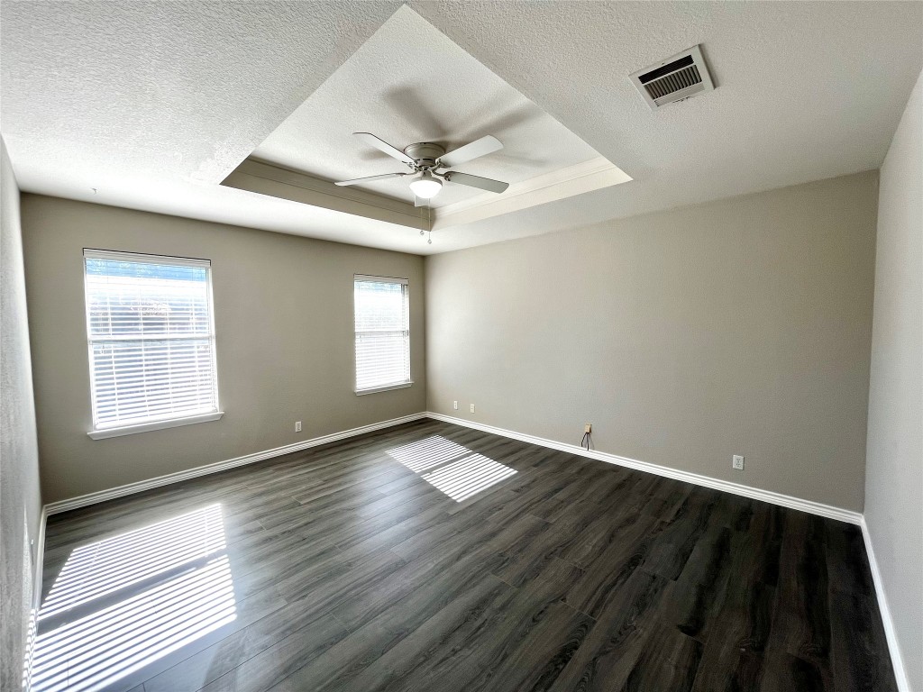206 Presidio Drive Leander, TX 78641 - Photo 4 of 14 wooden floor in an empty room with a window